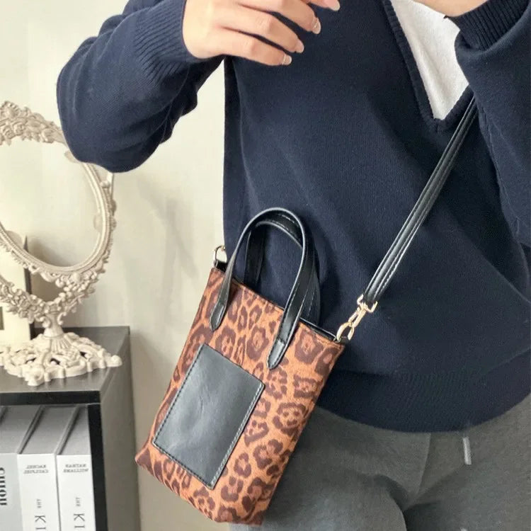 Two-tone suede purse with leather accents