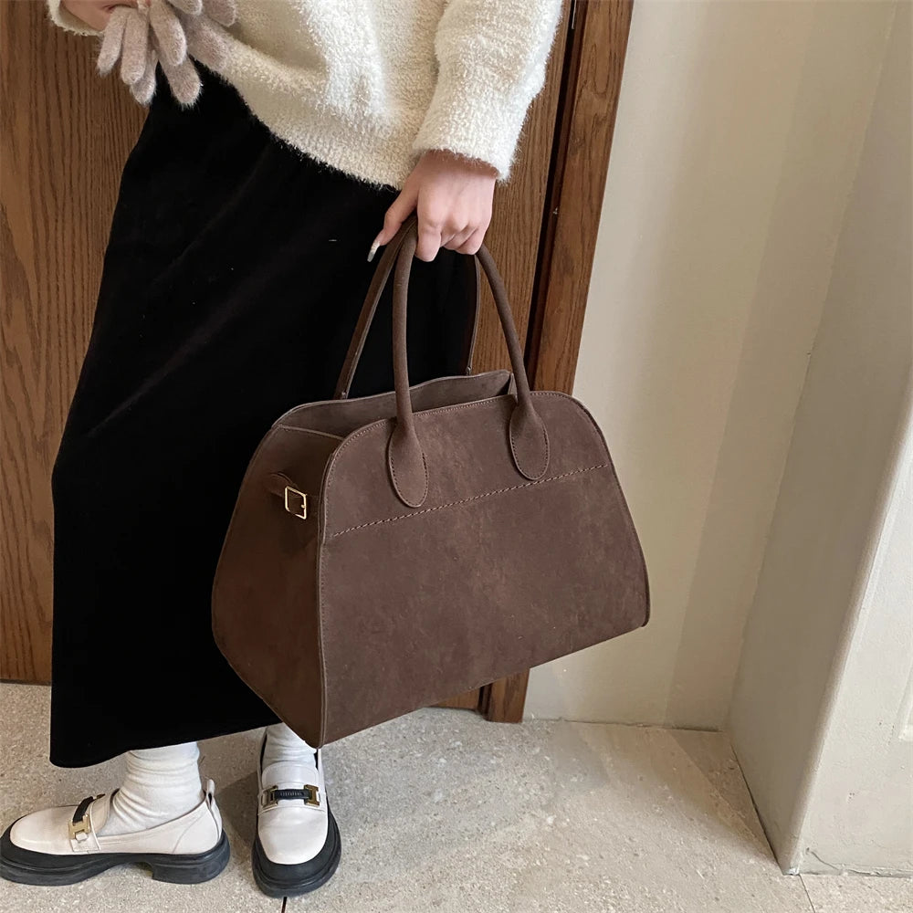 Suede handbag with shoulder strap