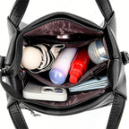 Leather handbag with wide base