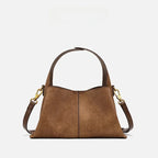Suede handbag with rounded handles and zip closure