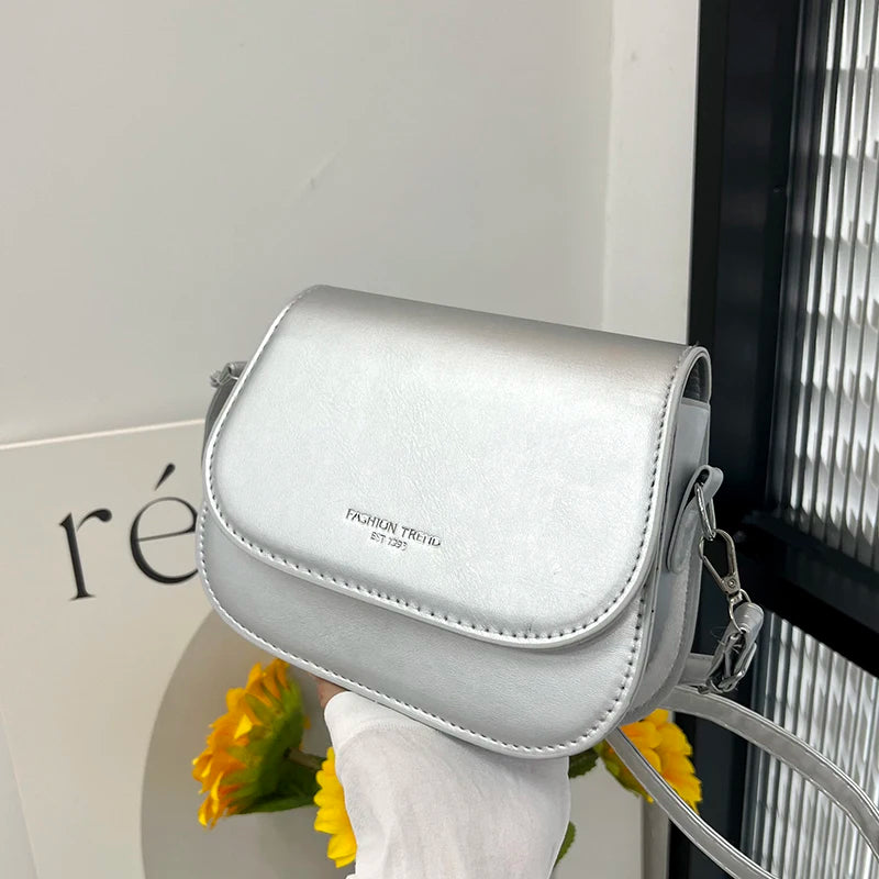 Compact leather sling crossbody