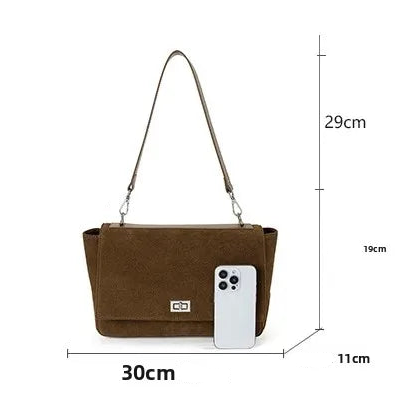 Textured suede handbag with flap closure