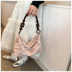 Corduroy handbag with wooden bead handle