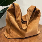 Suede slouch bag with relaxed boho silhouette
