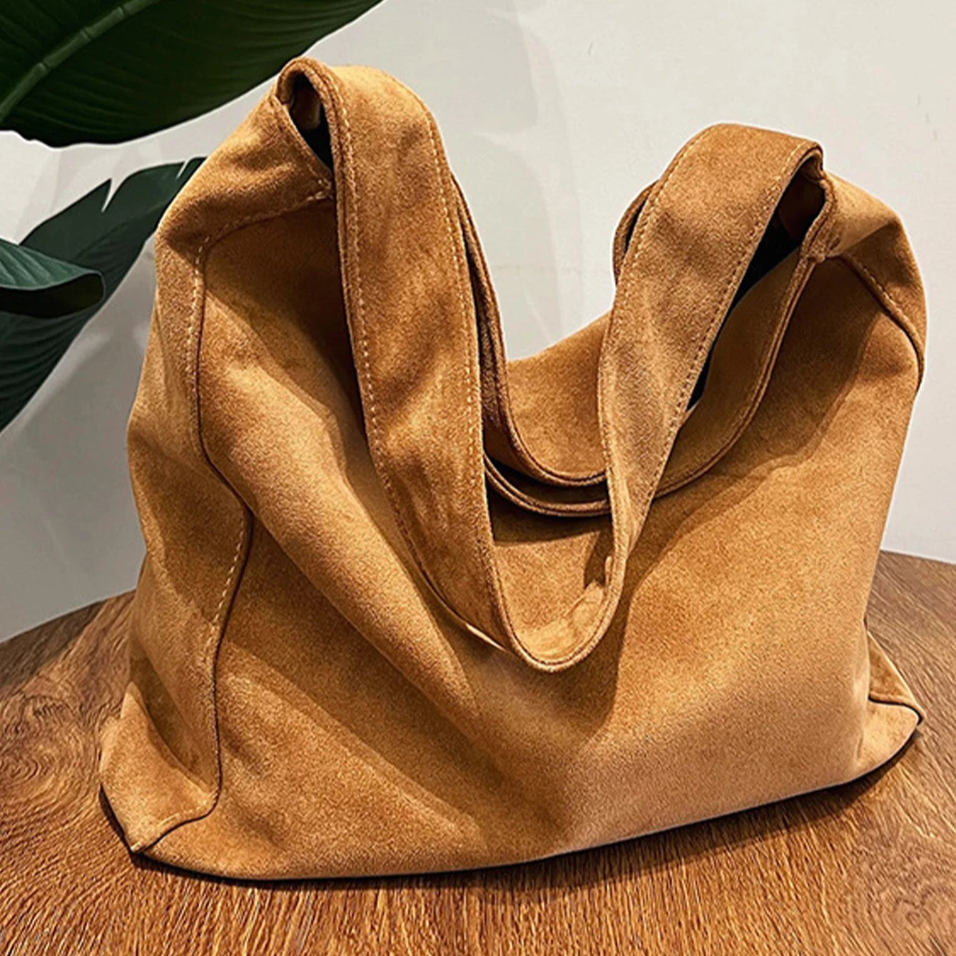 Suede slouch bag with relaxed boho silhouette