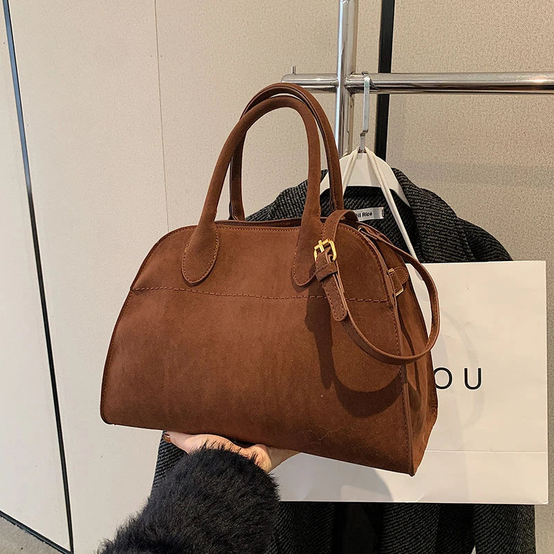 Suede handbag with shoulder strap
