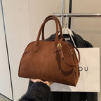 Suede handbag with shoulder strap