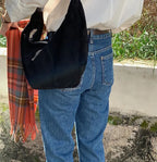 Soft suede slouch bag with single shoulder carry
