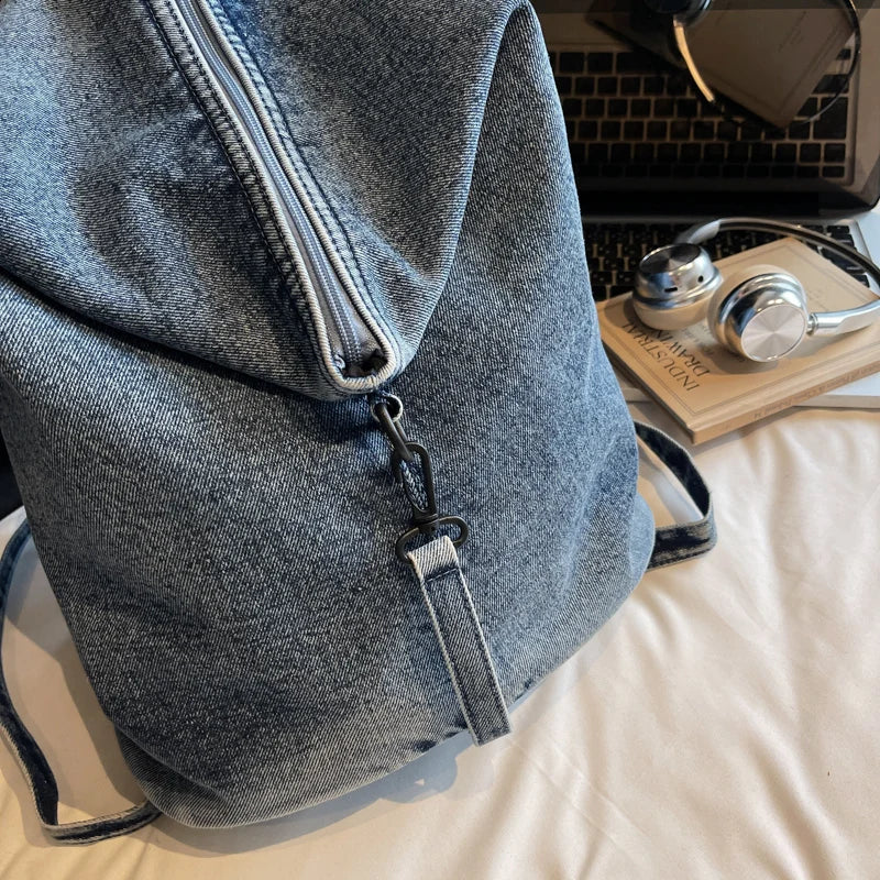 Washed denim backpack with adjustable straps