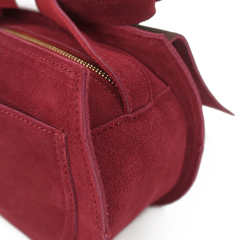 Fold-over suede shoulder bag