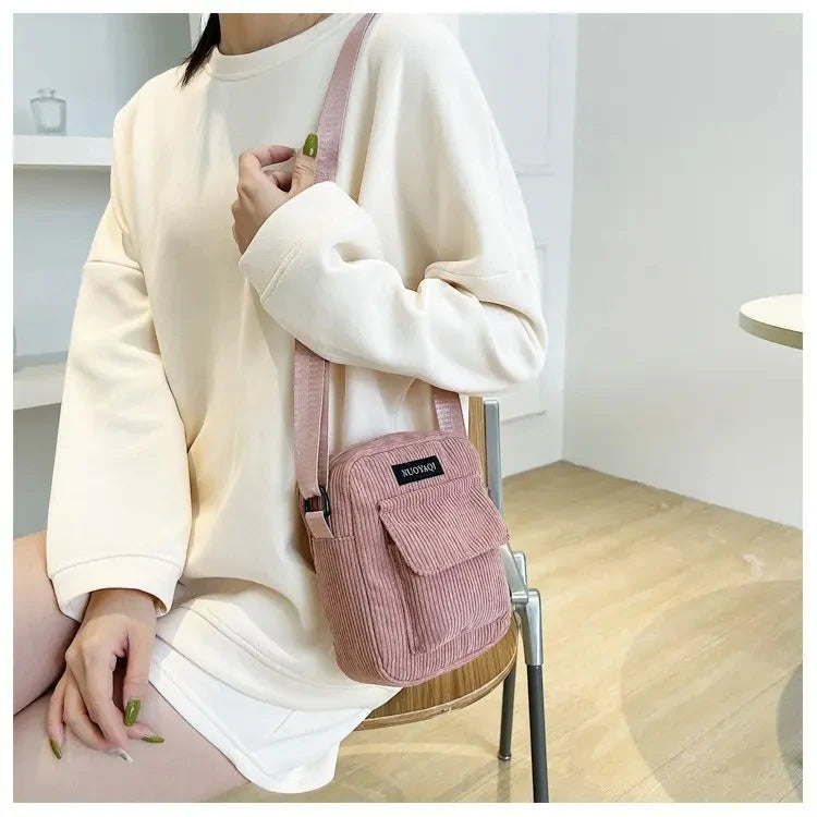 Corduroy crossbody handbag with front pocket