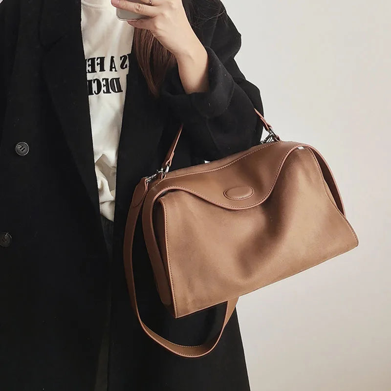 Suede handbag with subtle colors