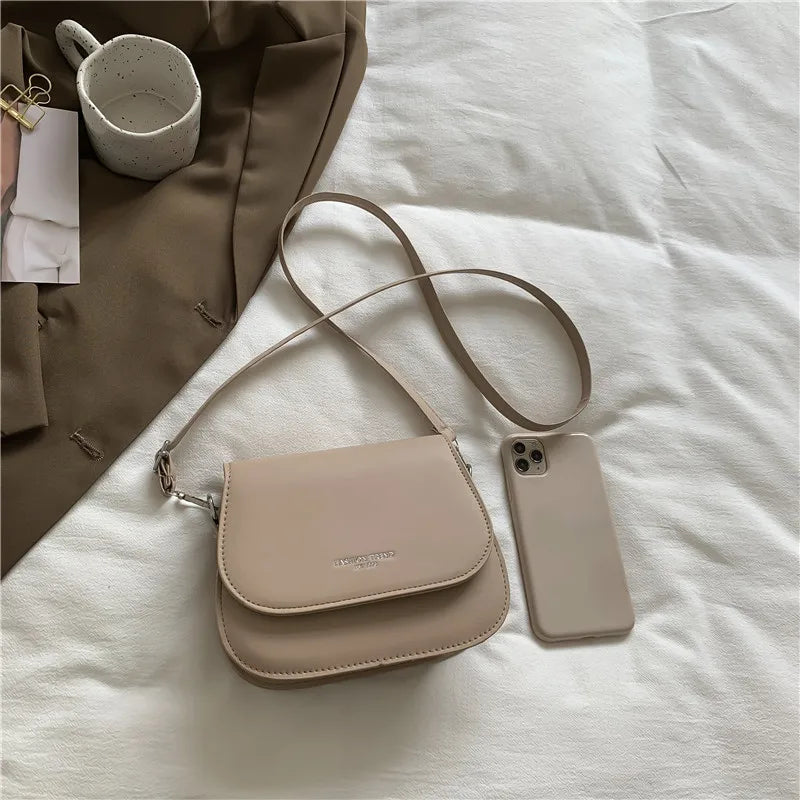 Compact leather sling crossbody