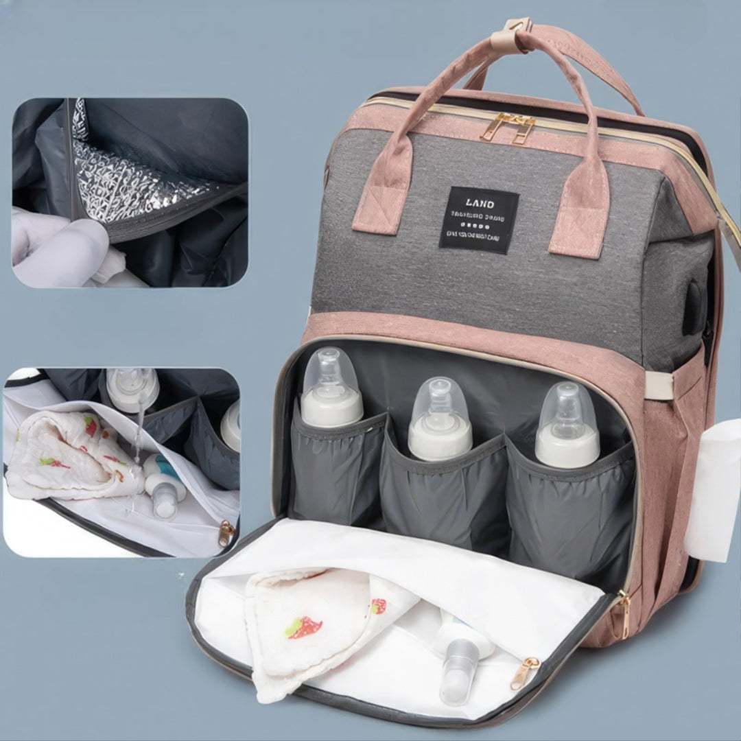 Pink diaper backpack with built-in bed