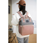 Blue diaper backpack with built-in bed