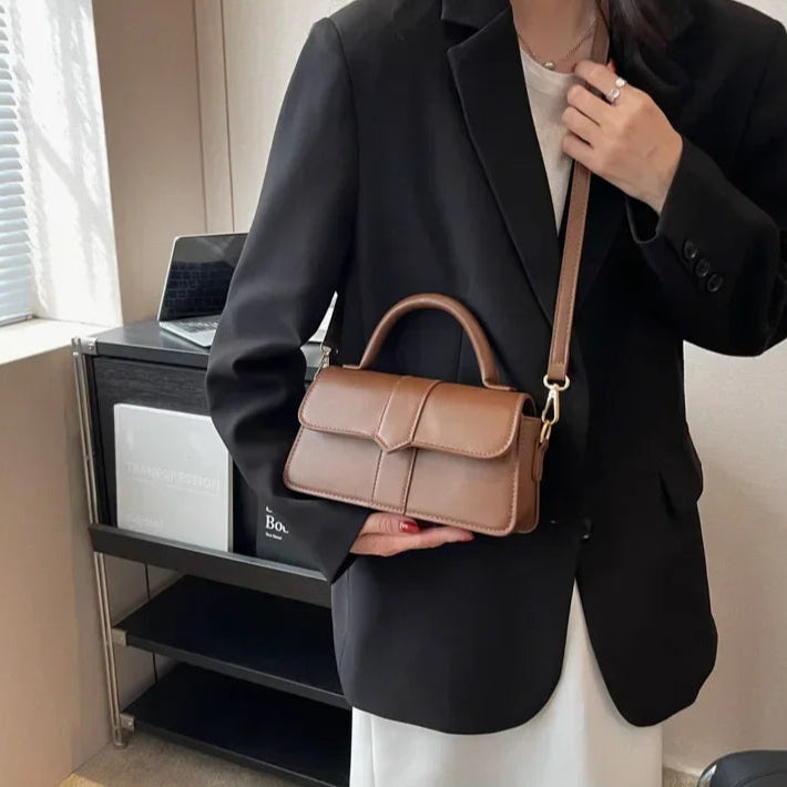 Compact leather sling bag for daily essentials