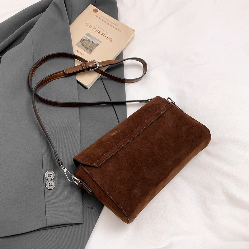Structured suede handbag with minimalist shape