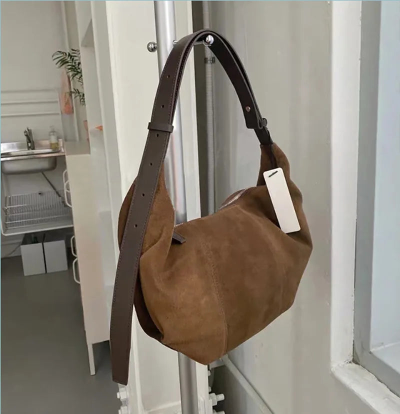 Soft suede slouch bag with single shoulder carry