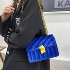 Corduroy handbag with chain and flap closure