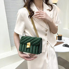 Corduroy handbag with chain and flap closure
