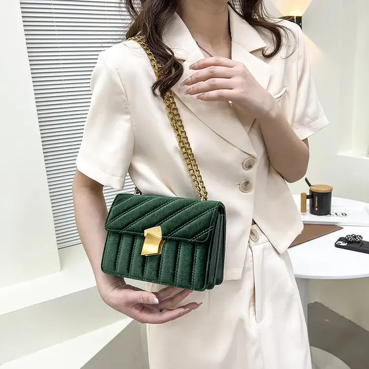 Corduroy handbag with chain and flap closure