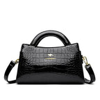 Soft leather handbag with curved top edge