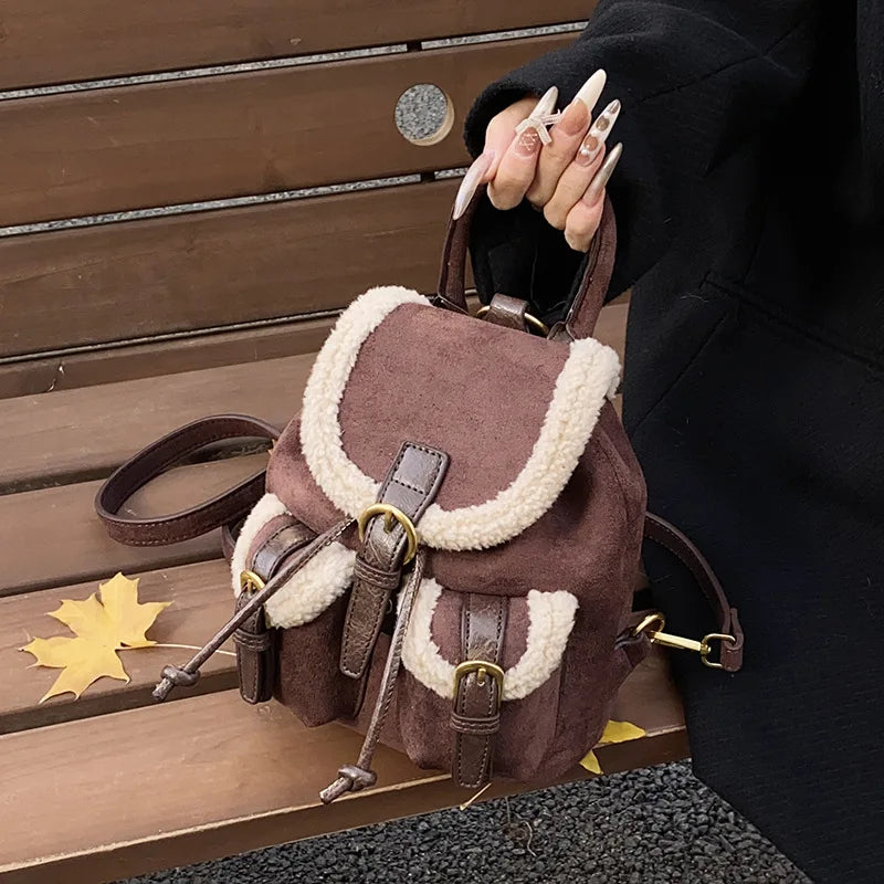 Suede backpack with front pockets