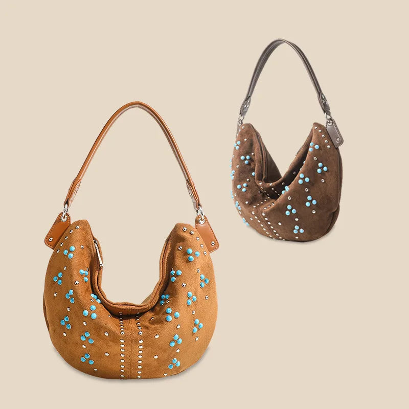 Soft suede handbag with elegant curved silhouette