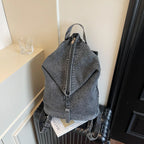 Washed denim backpack with adjustable straps