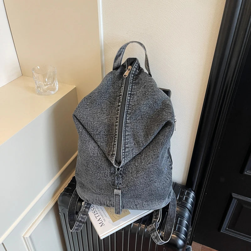 Washed denim backpack with adjustable straps
