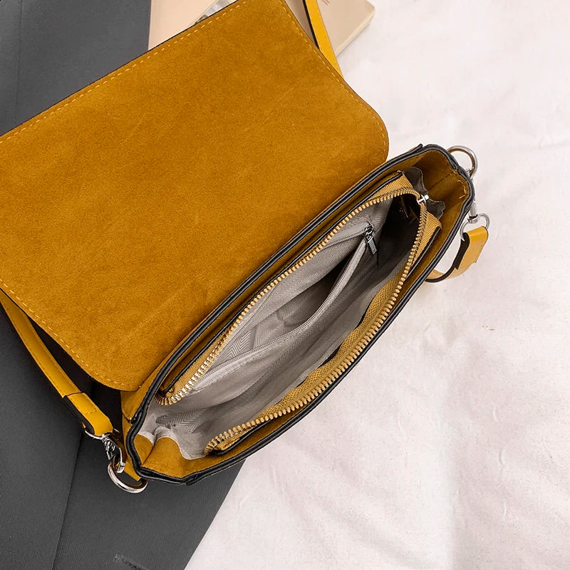 Structured suede handbag with minimalist shape