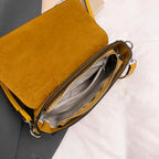 Structured suede handbag with minimalist shape