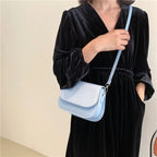 Compact leather sling crossbody