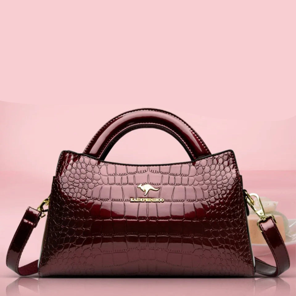 Soft leather handbag with curved top edge