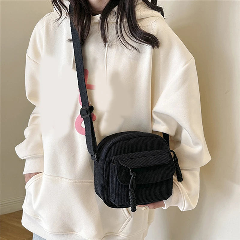 Small corduroy handbag with front zipper pocket