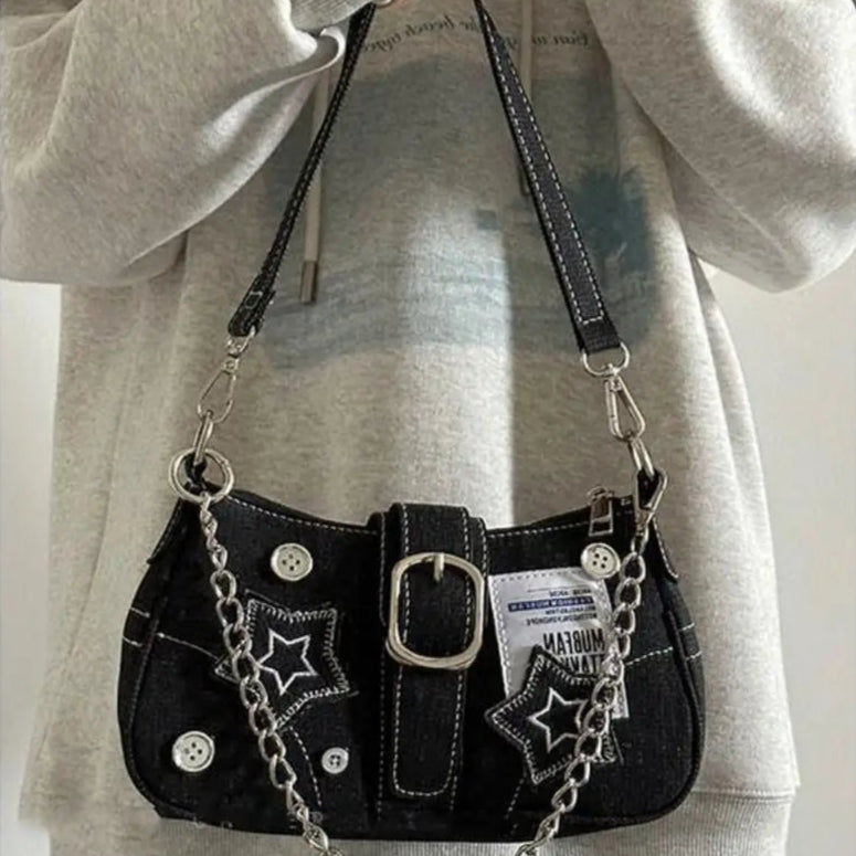 Edgy black denim handbag with buckle strap