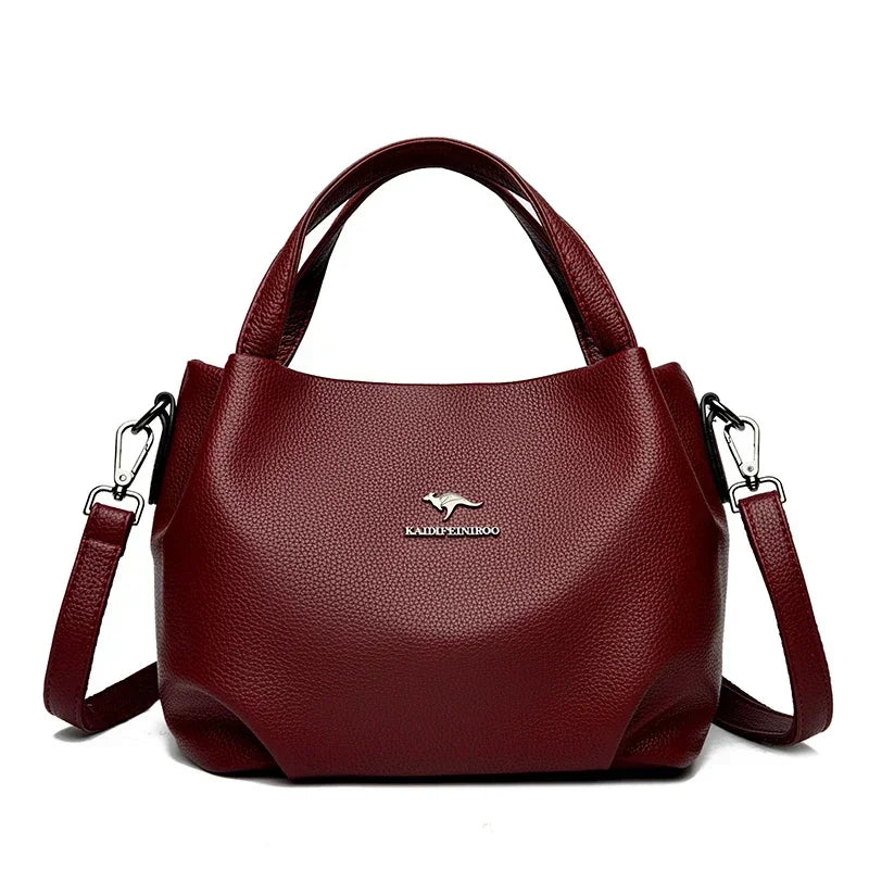 Leather handbag with wide base