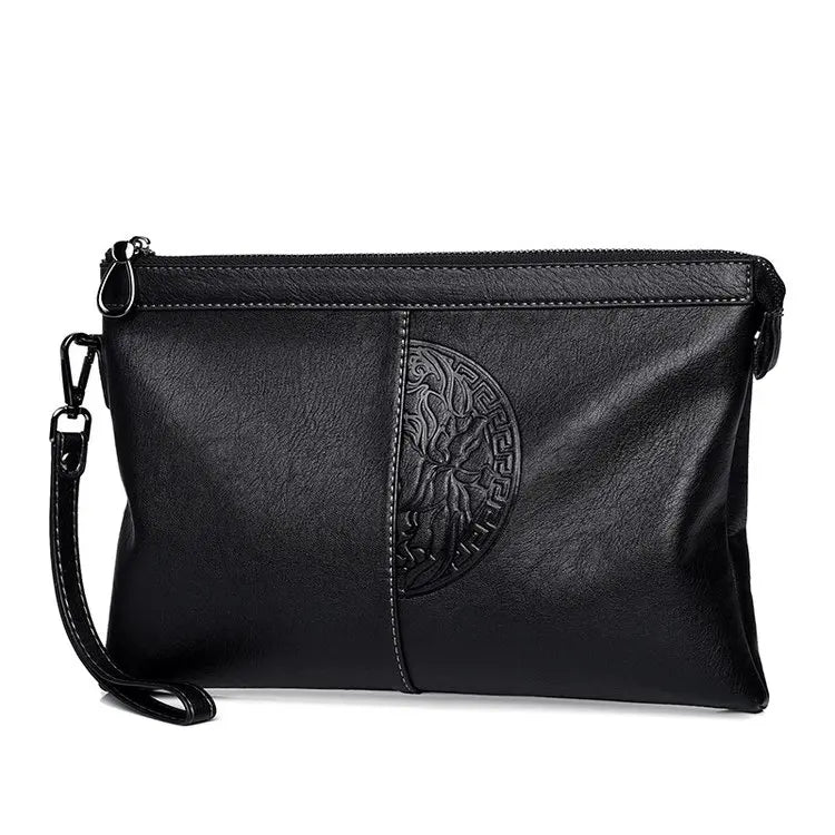 Minimalist leather clutch with detachable strap