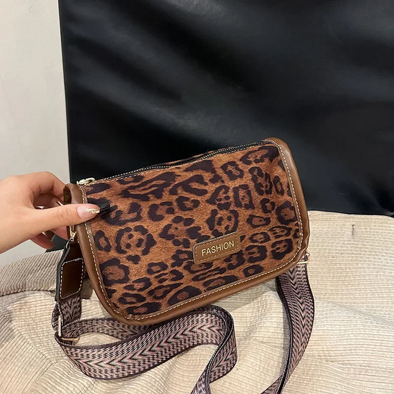 Sleek suede purse with wide shoulder strap