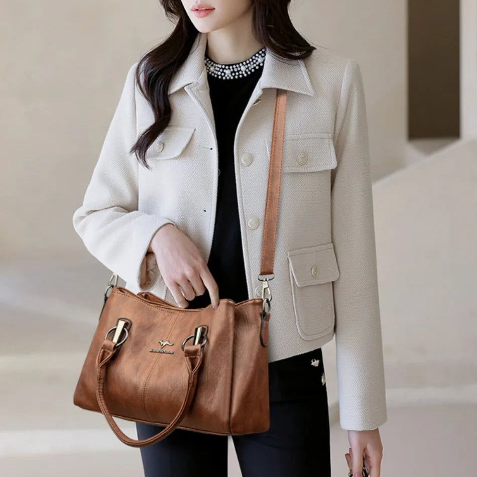 Leather handbag with detachable shoulder strap