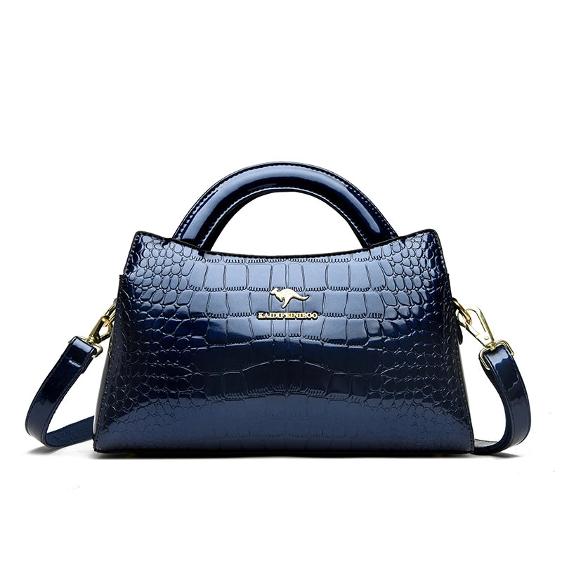 Soft leather handbag with curved top edge