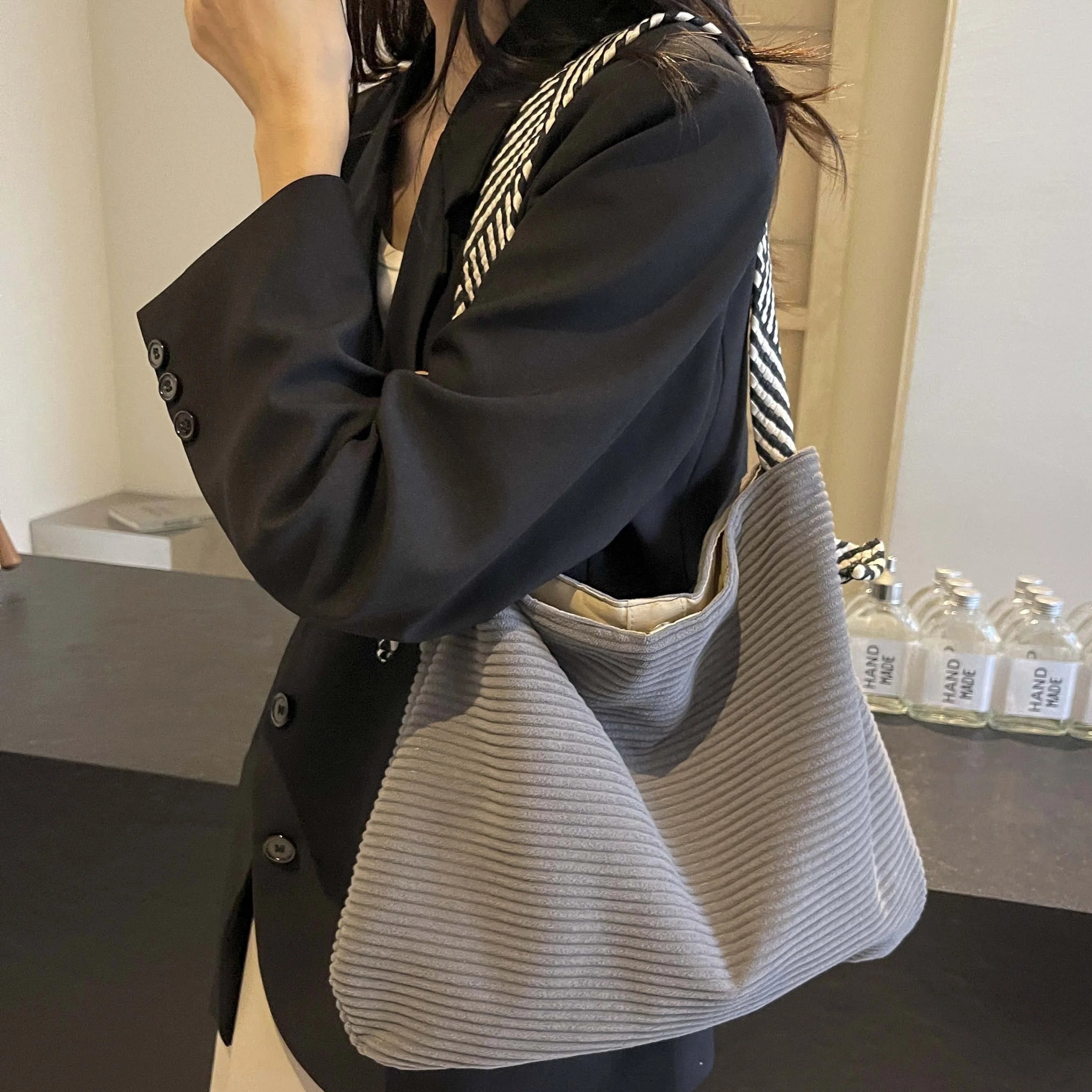Corduroy handbag with wide shoulder strap