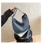 Soft washed denim shoulder bag with casual fold design