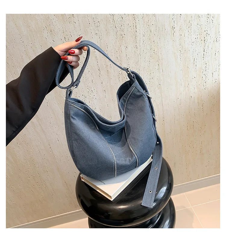 Soft washed denim shoulder bag with casual fold design