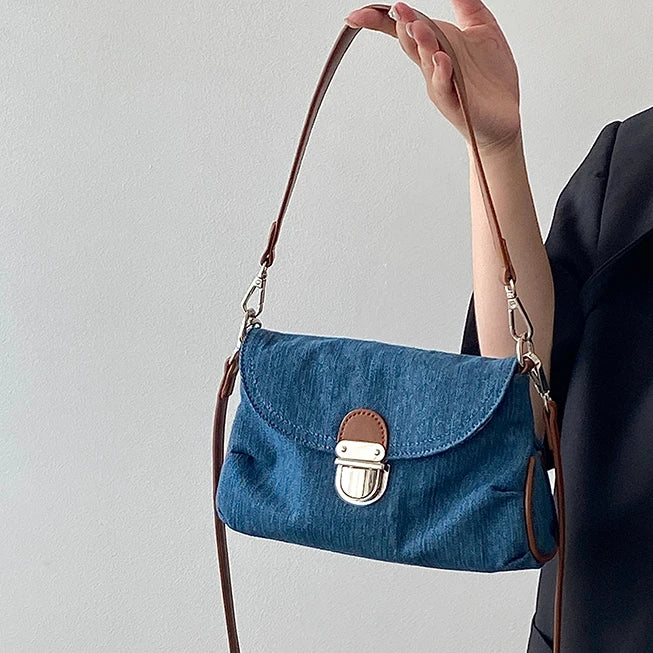 Denim handbag with leather handles