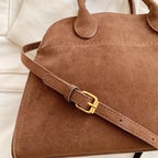 Suede handbag with shoulder strap