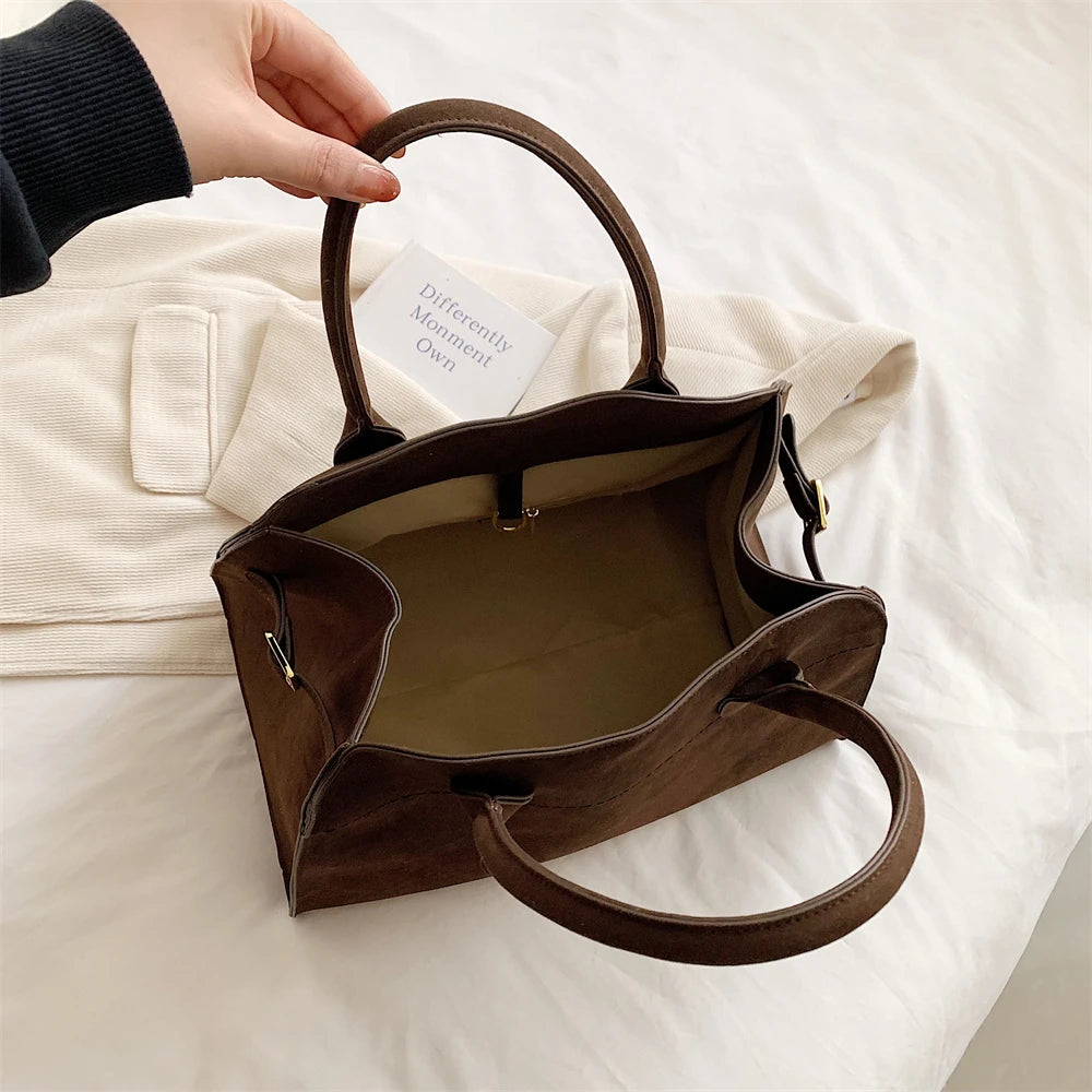 Suede handbag with shoulder strap