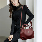 Leather handbag with wide base