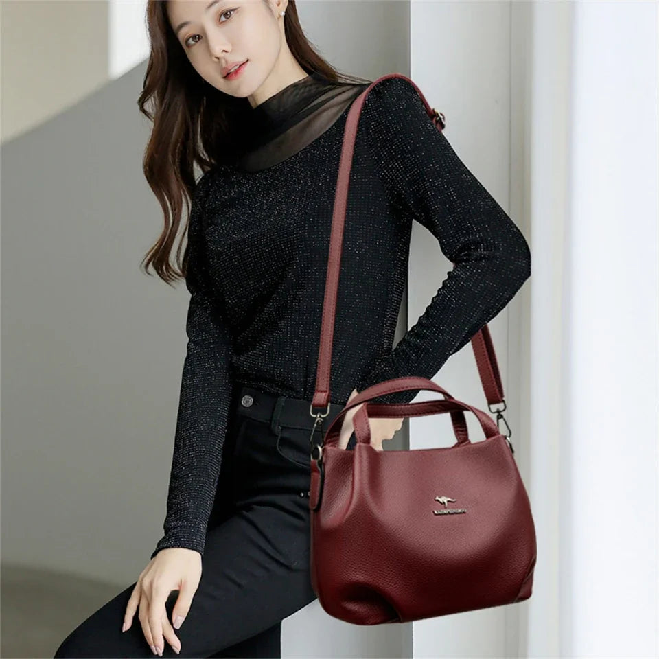 Leather handbag with wide base