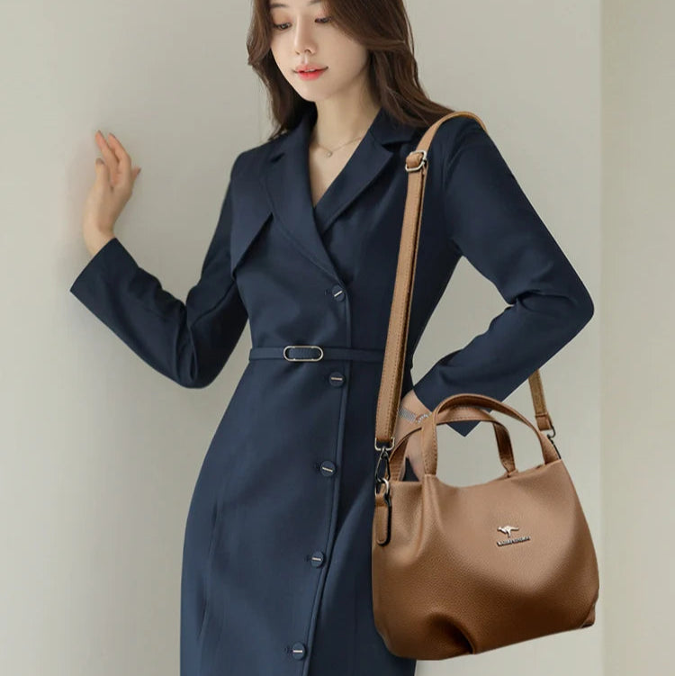 Leather handbag with wide base